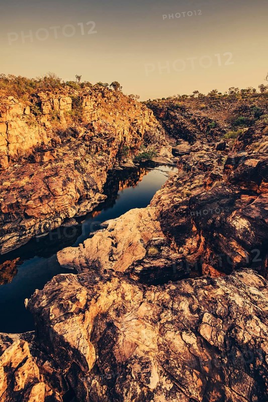 Bell Gorge waterfall, a body of water in north-west Australia in the Kimberley. Sunrise in the outback, Australia