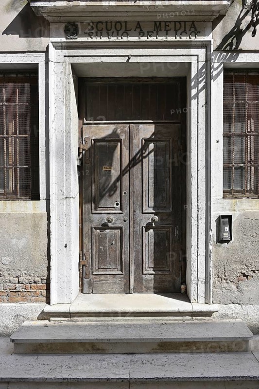 Nostalgic entrance to a school in an Italian village
