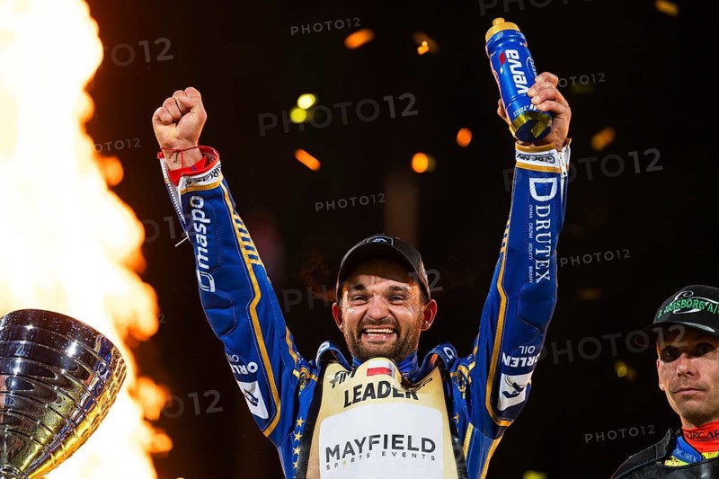 WROCLAW, POLAND - JUNE 20, 2026: DEWALT FIM Speedway GP of Poland. Speedway rider celebrating victory with trophy after race. Joy winner Bartosz Zmarzlik