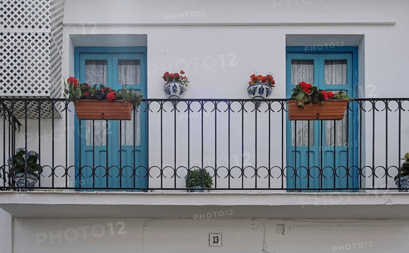 Balcony with two blue doors, Vinuela, Malaga Province, Andalucia, Spain
