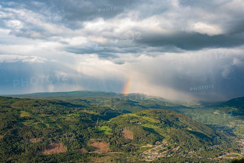 Rainbow and rain shower over Gol, Hallingdal, Buskerud, Norway