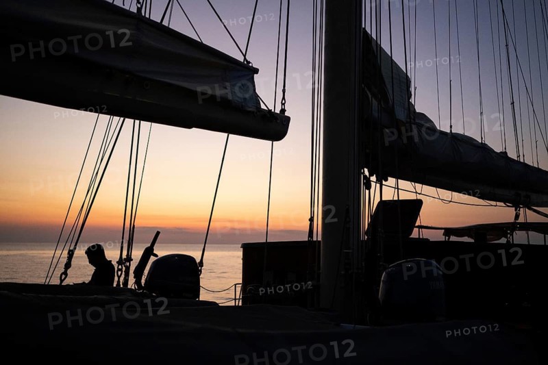 Daytime of a sailing ship, ropes, lines, sails, mast, sunset, Strait of Messina, Calabria, Aeolian or Aeolian Islands, Sicily, Southern Italy, Italy