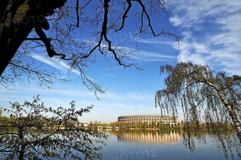 General view of the former incomplete Congress Hall of the NSDAP 1933-1945, in front the bun pond and trees, documentation center, Reichsparteitagsgelände, Bayernstraße 110, Nuremberg, Middle Franconia, Bavaria, Germany