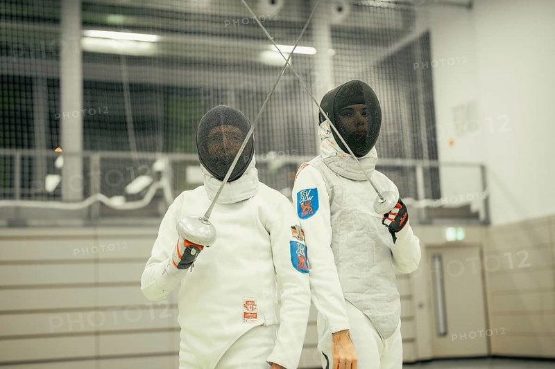 Two fencers pose with swords raised and full equipment in a sports arena, fencing, TSV Calw, Calw district, Germany