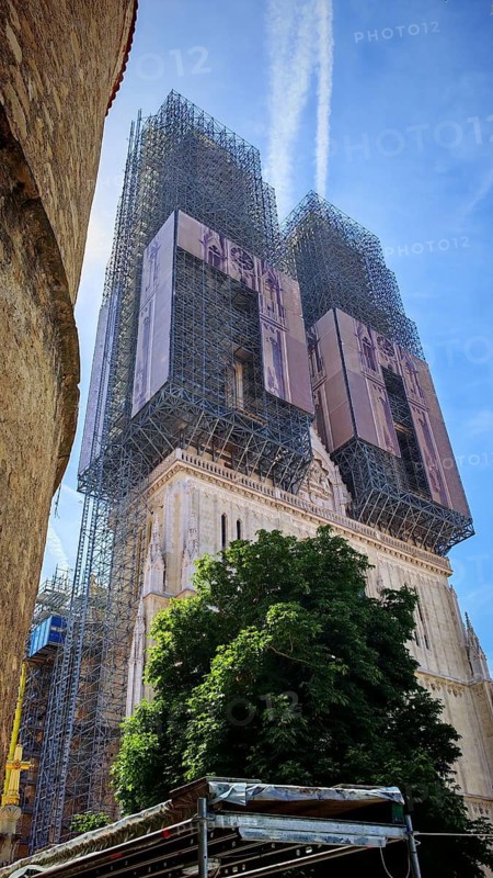 Zagreb Cathedral church tower under renovation with extensive scaffolding under blue sky, Zagreb, Croatia