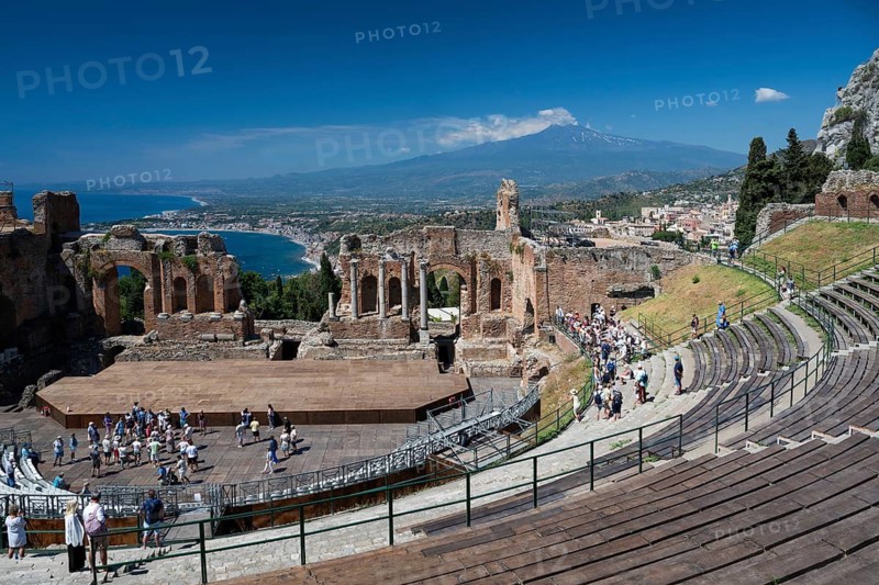 View of ancient theatre, the Mediterranean and Mount Etna, Taormina, Sicily, Italy