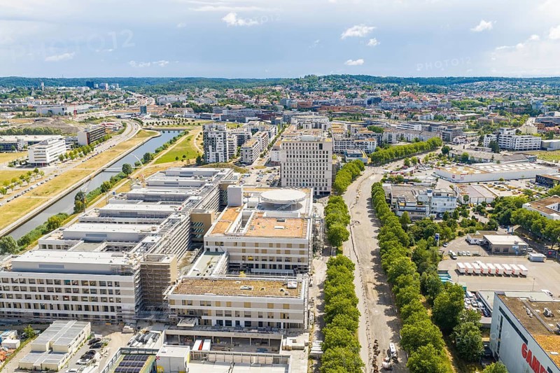 City landscape with river, buildings and parks along the banks from a bird's eye view, airfield, Böblingen, Germany