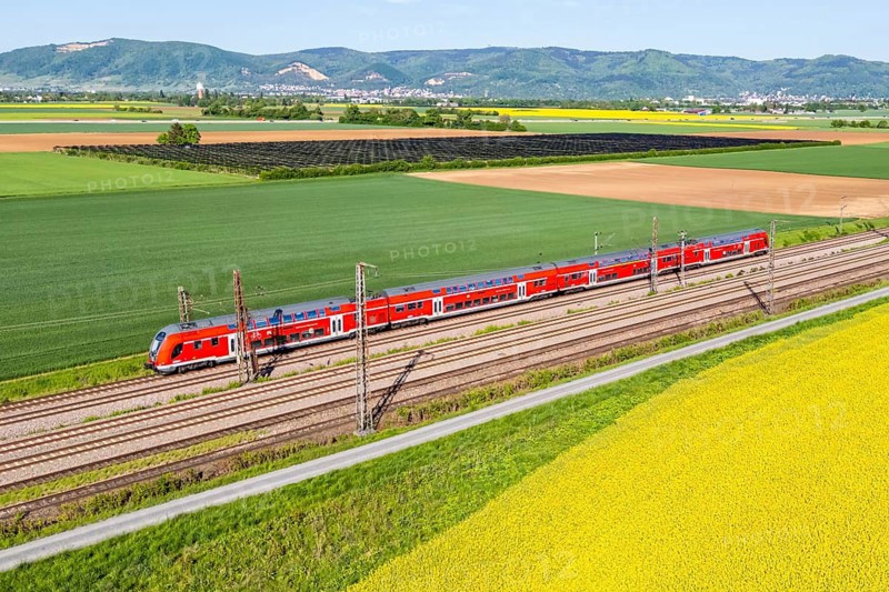 Aerial view of Deutsche Bahn DB Regio regional train Main-Neckar-Ried-Express on the Mannheim—Heidelberg railway line in Edingen, Germany