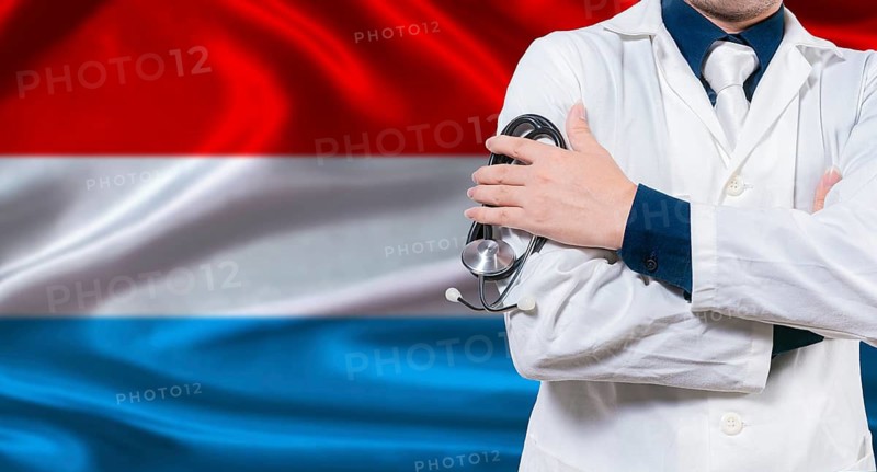 Luxembourgish national health system, Medical professional holding sthetoscope isolated