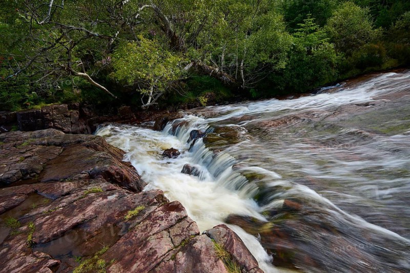 Small waterfall over rocks surrounded by thick vegetation, Victoria Falls, Slattadale, Achnasheen, Scotland, United Kingdom, Great Britain