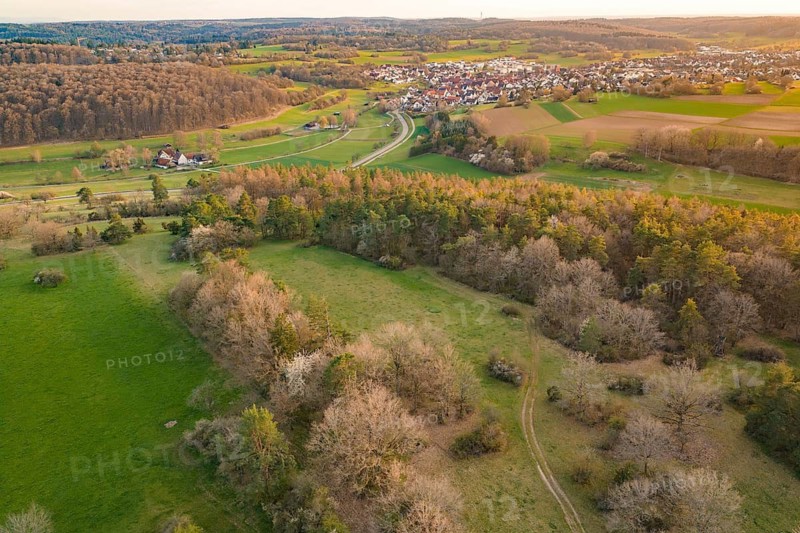 Village view with surrounding forests and fields in a gentle hilly landscape, e-bike tour, old sports field in Gechingen, hecken and Gäu region, Calw district, Germany