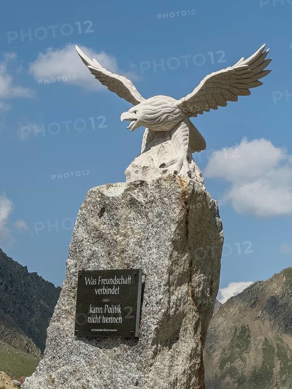 Detailed photo Eagle Memorial Stone Friendship Memorial with memorial plaque Memorial plaque at the pass of Timmelsjoch Passo Rombo Pass Road today's border pass between Austria and Italy to commemorate the separation of between Tyrol and South Tyrol Alto Adige with inscription What unites friendship cannot divide, Timmelsjoch, Tyrol, Austria, Passo Rombo, South Tyrol, Alto Adige, Italy