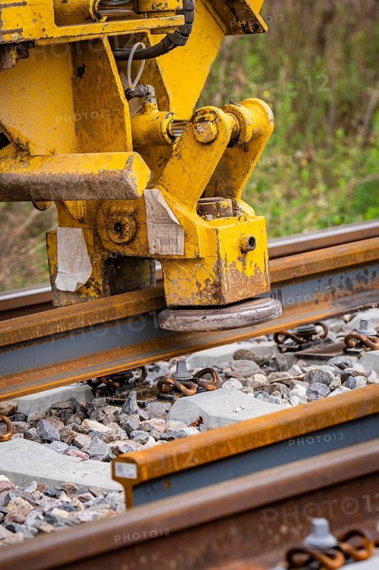 Yellow construction machine working on a railway track, track construction, Hermann Hessebahn, Calw, Black Forest, Germany