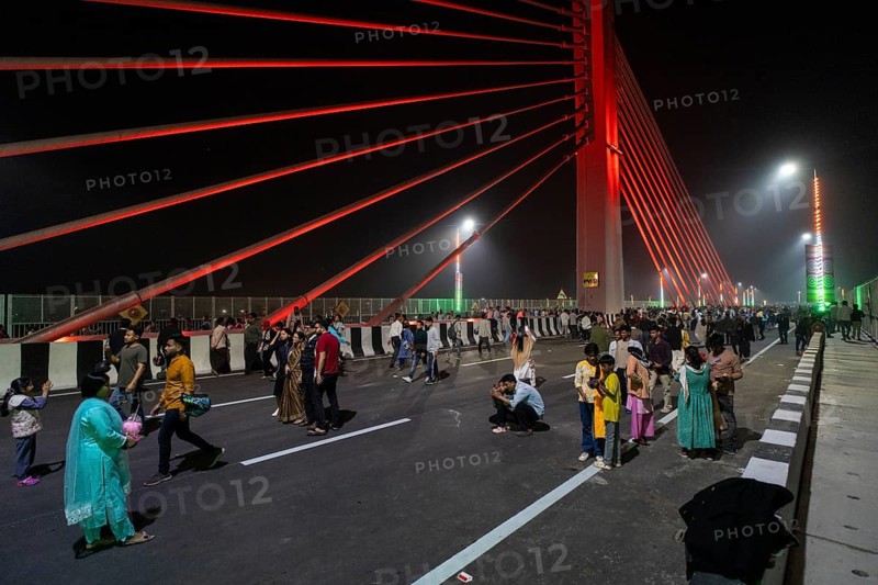 People gather on the newly inaugurated Kumar Bhaskar Varma Setu, a six-lane cable styled bridge over the Brahmaputra River, in Guwahati, India on 15 February 2026