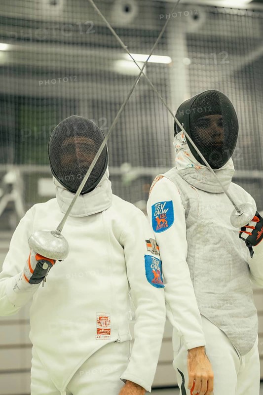 Two fencers hold their swords ready and look proudly at the camera as they pose in gear, fencing, TSV Calw, Calw district, Germany