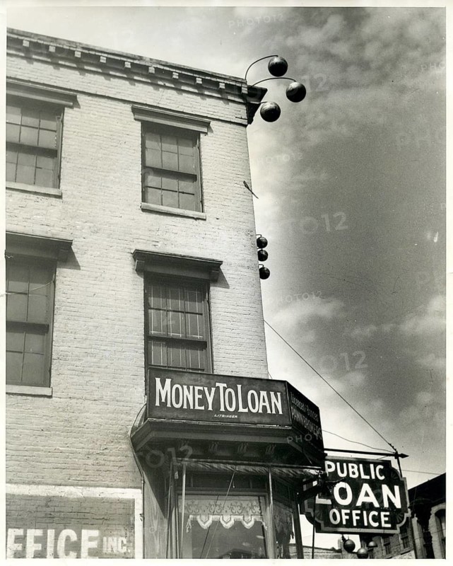 Money to Loan, pawnshop, loan office, USA, small town, traditional signs on the house, 3 bullets, old building with signs for a pawn loan in an urban area, around 1935
