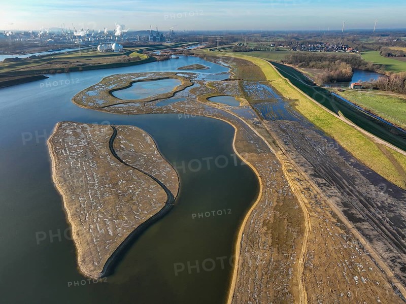 Haltern-Marl, North Rhine-Westphalia, Germany - Lippe, flood protection in the Haltern-Lippramsdorf-Marl area (HaLiMa) . Flood protection on the River Lippe by relocating the dyke and thus extending the floodplain. On the right, the completed floodplain north, the north dyke. Work is still underway on the south dyke. Marl Chemical Park in the back