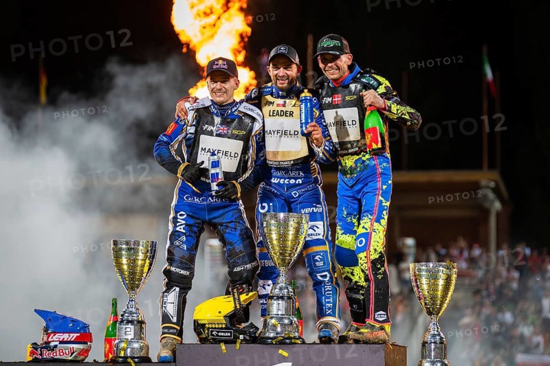 WROCLAW, POLAND - JUNE 20, 2026: DEWALT FIM Speedway GP of Poland. Speedway riders celebrating victory with trophy after race. Joy winnersylwetka silhouette 2. Robert Lambert 1. Bartosz Zmarzlik 3. Michael Jepsen Jensen