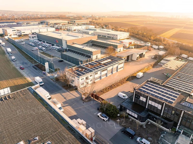 A building in an industrial environment with solar panels on the roof, Bauhof, Nufringen, Germany