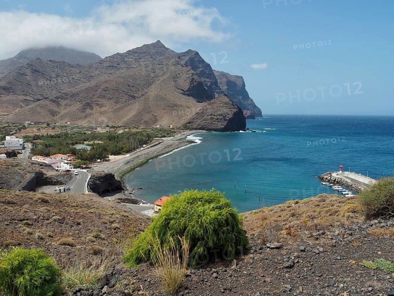 Small bay with village and coastal landscape, surrounded by mountains and clear water, La Aldea de San Nicolas, Gran Canaria, Spain