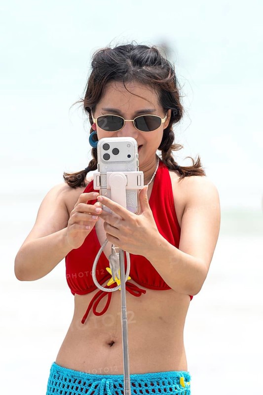 Woman selfie on beach, Koh Larn, Thailand