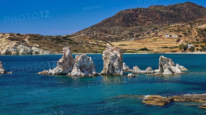 Cliffs in a calm turquoise sea under a clear blue sky, Aspragremna, White Cliffs, Mavorspilia Beach, Kimolos Island, Kimolos, Cyclades, Greek Islands, Greece