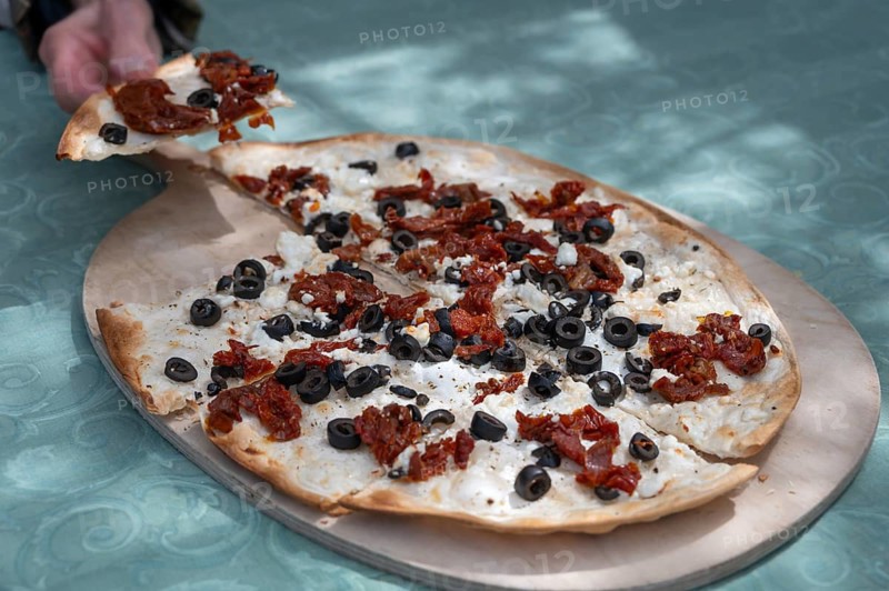 Flammkuchen, Mediterranean served on a wooden board, Franconia, Bavaria, Germany