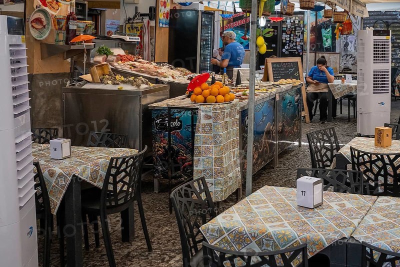View of a food stand with tables, Palermo, Sicily, Italy