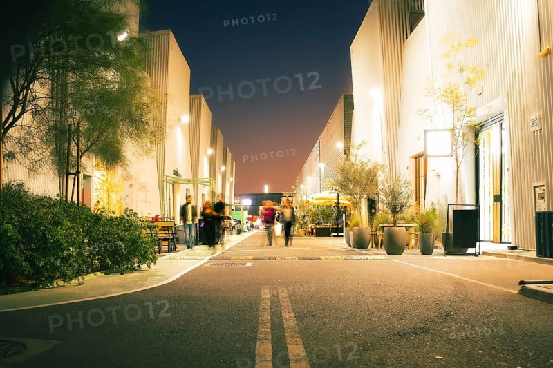 Dubai, UAE - 16th january, 2026: Alserkal Avenue at night in Al Quoz. Visitors visit Industrial galleries, shops, cafes and creative hubs illuminated under festive string lights