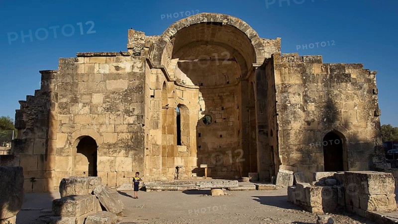 Titus Basilica, Greece, large ancient stone structure with archway against blue sky, Gortyn, Gortyna, Gortys, ancient city in central southern Crete, later capital of the Roman province of Creta, Crete, Greek islands, Greece