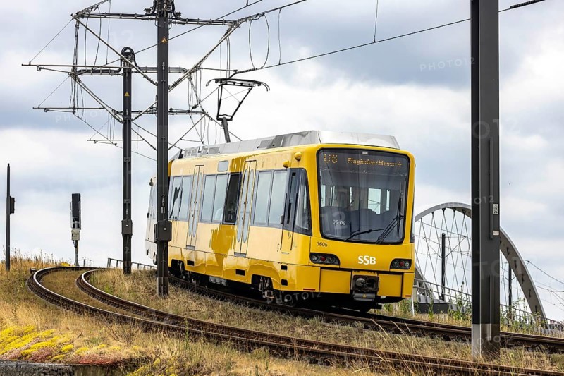 Light rail line U6 to the airport and the exhibition center. Stuttgarter Strassenbahnen AG, SSB. The 127 meter long and column-free network arch bridge is the first structure in the world to be suspended from carbon suspension ropes. Stuttgart, Baden-Württemberg, Germany