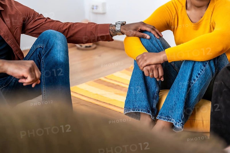 Group members offering comfort and emotional support during a therapy session, highlighting empathy, connection, and community in mental health healing