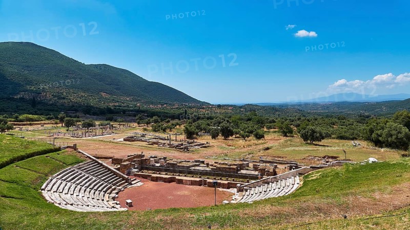 Ancient amphitheatre in a vast, green landscape with mountains in the background, ancient site, archaeological site, Messene, Messini, Messinia, southwest of the Peloponnese, odyssey, Odyssey, Odysseus, Ulysses, film, filming location, Matt Damon, Peloponnese, peninsula, Greece