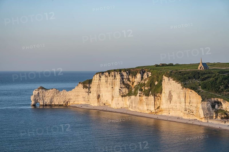 View from the Falaise d'Aval viewpoint to the opposite, steeply rising cliffs of the Falaise d'Amont rock formation and the Notre Dame de la Garde chapel above it, Alabaster Coast, La Côte d'Albâtre, chalk cliffs, English Channel, Seine-Maritime, Normandy, France