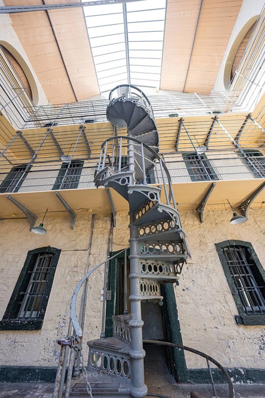 Close-up of a metal spiral staircase up to gallery levels in an old building, Kilmainham Gaol Prison, Dublin, Ireland