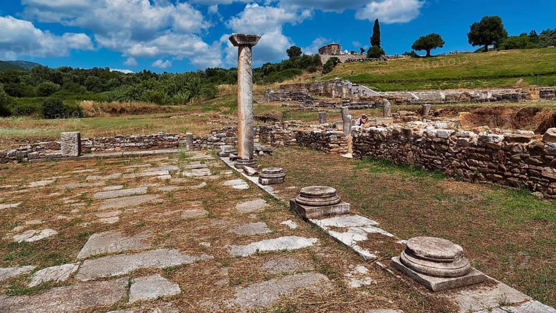 Ancient ruins with isolated stone columns in green landscape under blue sky, ancient site, archaeological site, Messene, Messini, Messinia, southwest of the Peloponnese, odyssey, Odyssey, Odysseus, Ulysses, film, filming location, Matt Damon, Peloponnese, peninsula, Greece