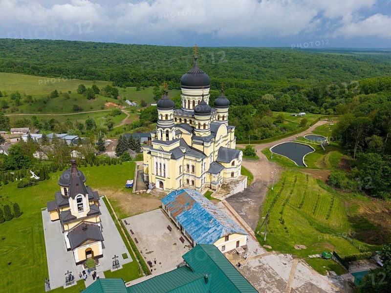 Dome-crowned monastery in vast green countryside and peaceful surroundings, aerial view, Hîncu monastery, Hâncu, Hâncul, Hincu, Hancu, Hancul, located near the village of Bursuc, Nisporeni district, Republic of Moldova, Moldova