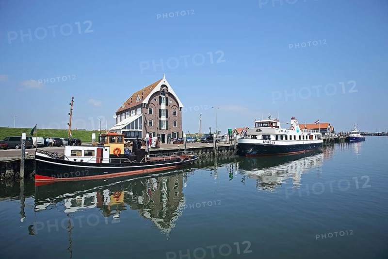 Harbour with brick house and boats, ships on quay wall, reflection, Oudeschild, Texel, North Holland, Holland, Netherlands