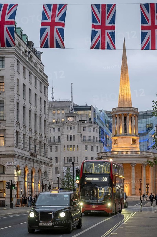 Red double-decker bus and taxi in front of All Souls Langham Place, Church of John Nash and BBC Broadcasting House, evening mood, London, London region, England, United Kingdom