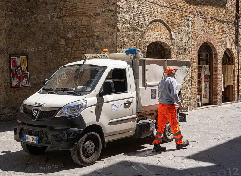 City cleaning employee with his vehicle, Pienza, Tuscany, Italy