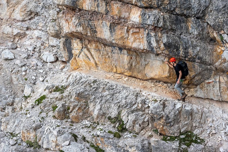Hikers on the Via Ferrate Benini via ferrata on a cliff, Brenta Mountains, Parco Naturale Brenta-Adamello, Trentino, Italy
