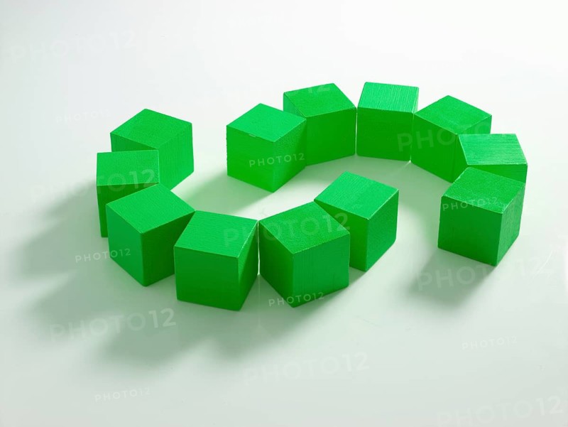 12 green wooden cubes against a white background