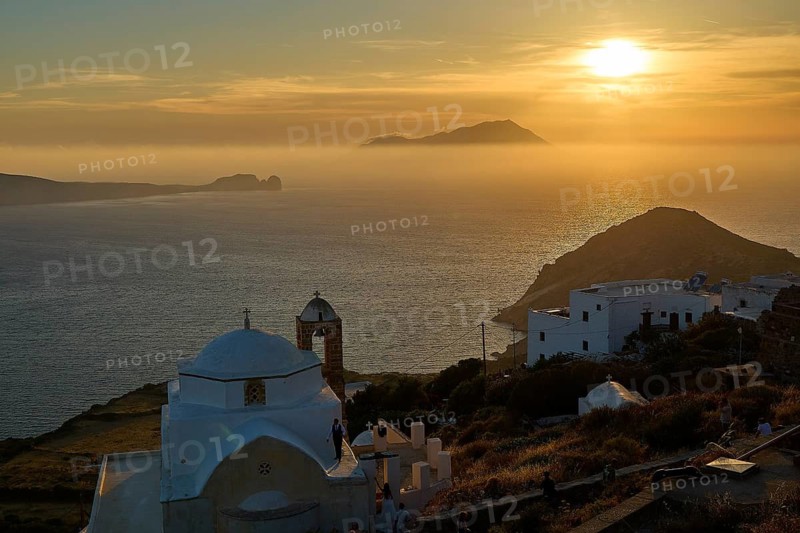 Panagia of Thalassitra church, Panagia Thalassitra, sunset over the sea with a church in the foreground and island silhouettes in the background, Plaka, main town on Milos, island of Milos, volcanic island, Cyclades, Greek islands, Greece
