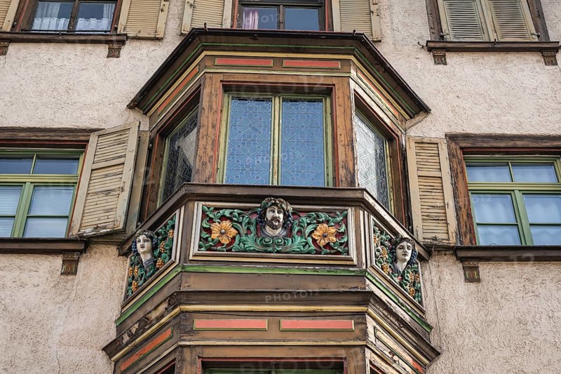 Detailed view of the former Gasthaus zum goldenen Becher in the historic old town of Rottweil, which was already mentioned as an inn in 1713. The wooden bay window was artfully decorated by the well-known German sculptor and mask carver German Burry, Rottweil district, Baden-Württemberg, Germany