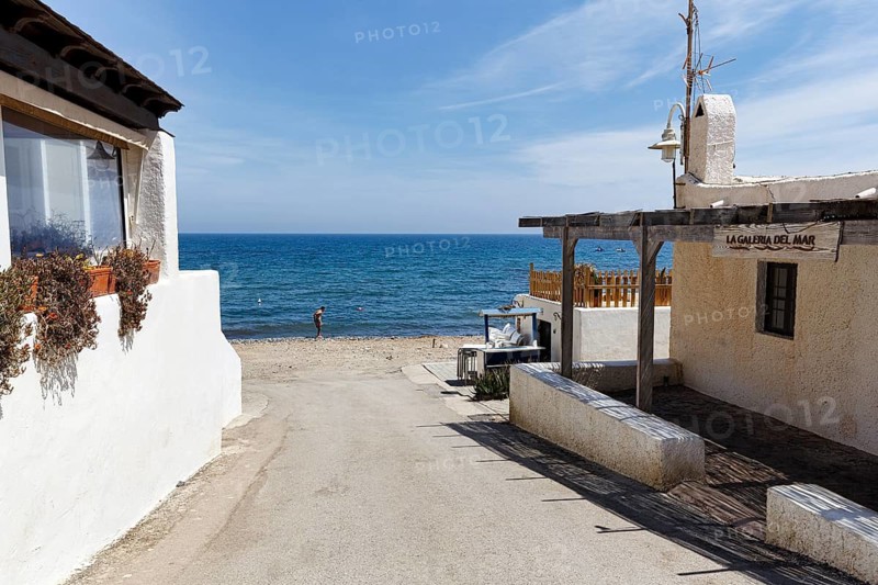 Relaxed fishing village, access to the sea, characteristic alley, Playa de las Negras, Nijar, Cabo-de-Gata-Nijar, Almeria, Andalucia, Spain