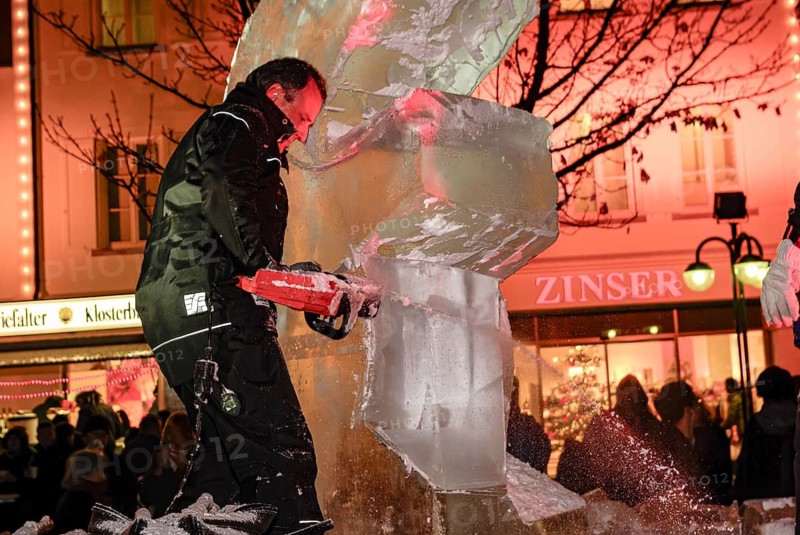 An ice sculpture is being created: ice carving street action as part of the long shopping night in the city center of Reutlingen, Baden-Württemberg, Germany, for editorial use only