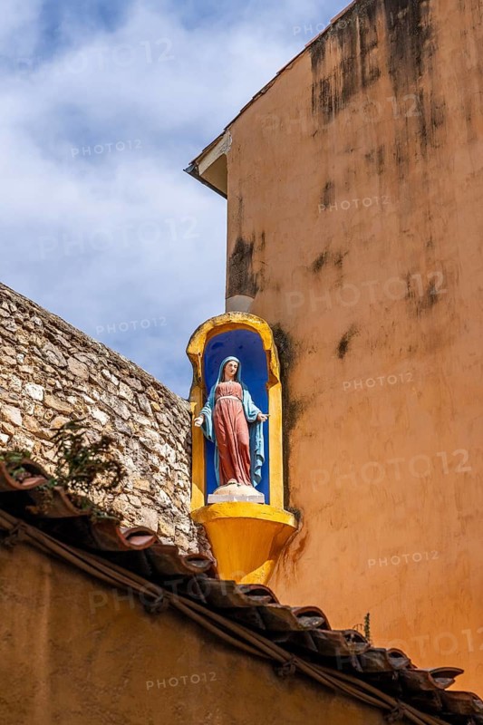 Wayside shrine with Madonna on a house façade in the old town of Aix-en-Provence, Bouches-du-Rhone, Provence, France