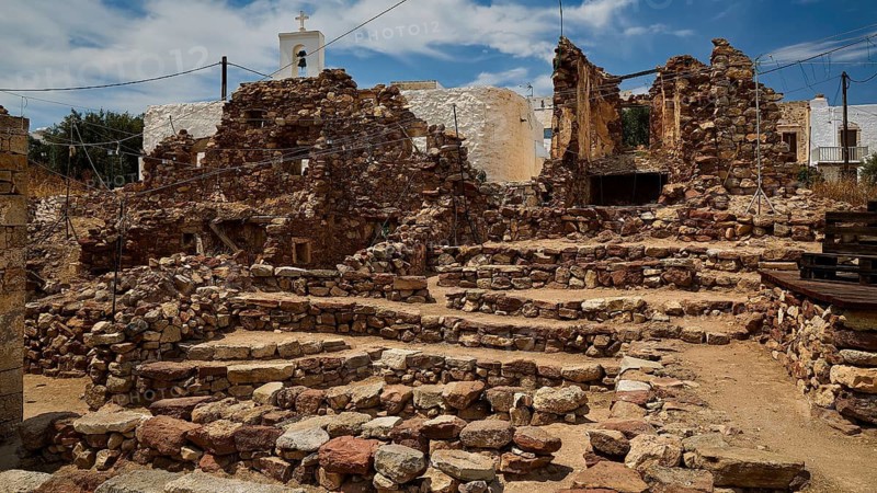 Old brick ruins with a small church in the background under a blue sky, Kastro, old castle above Chorio, Kimolos, Cyclades, Greek Islands, Greece
