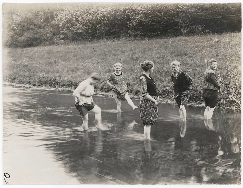 Bathing, swimwear, woman, stream, leisure, fun, summer, woman in rural surroundings wading through shallow water in the river, around 1922