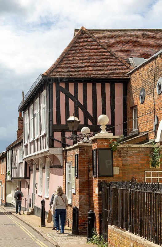 Historic timber-framed buildings entrance to Tymperleys, Trinity Street, town centre of Colchester, Essex, England, UK